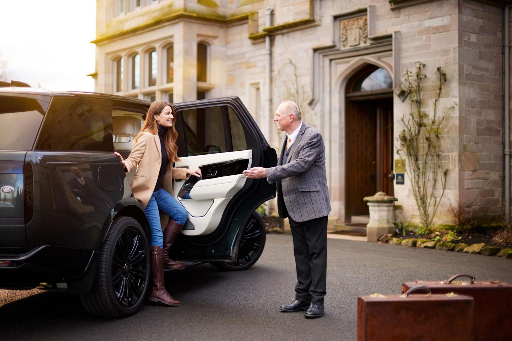 Schloss Roxburghe, Part Of Destination By Hyatt Eksteriør billede A chauffeur opening the car door for a passenger